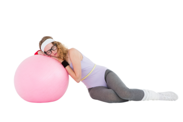 Geeky hipster resting on fitness ball