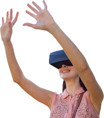 Young woman with arms raised looking through virtual reality simulator