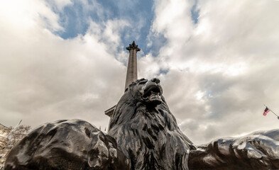 Statue of lion at the base of Nelson's Column, Trafalgar Sq. London