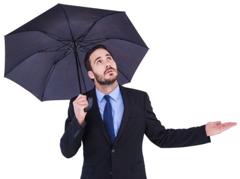 Businesswoman holding umbrella while testing if it rains