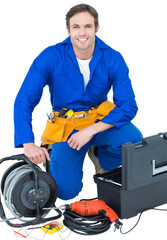 Confident electrician with tools