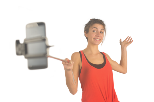 Casual brunette using selfie stick