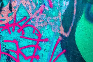 Closeup of colorful teal, pink, blue, green urban wall texture. Modern pattern for wallpaper design. Creative modern urban city background for advertising mockups. Grunge messy street style background