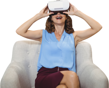 Happy woman using virtual reality glasses while sitting on sofa