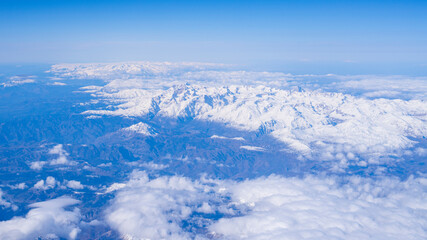 Sky, clouds, snowy mountains, sunny and beautiful sky view.