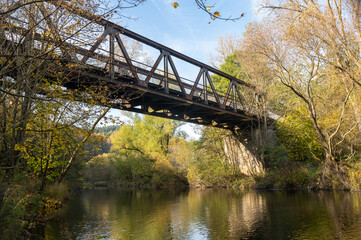 Iron bridge over a river in nature