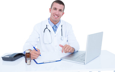 Portrait of smiling male doctor writing while sitting by desk 