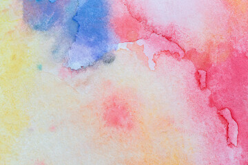 Macro close-up of an abstract colorful watercolor gradient fill background with watercolour stains. High resolution full frame textured paper background. Copy space.