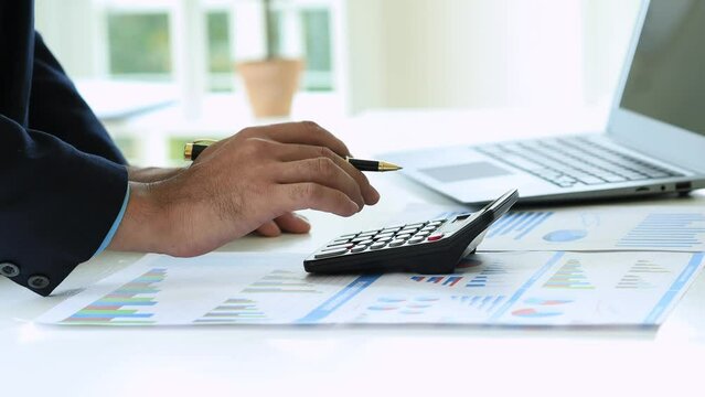 Company finance staff preparing financial documents, company finance staff preparing company finance documents to bring to the meeting to summarize for management's acknowledgment. Financial concept.