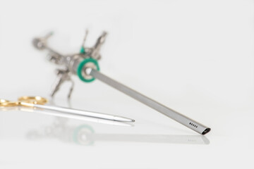 Closeup of Reusable Laparoscopic Surgical Tool on White Background. Product photography of surgical tools. 