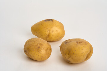yellow potatoes isolated on white 