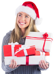 Festive blonde holding pile of gifts