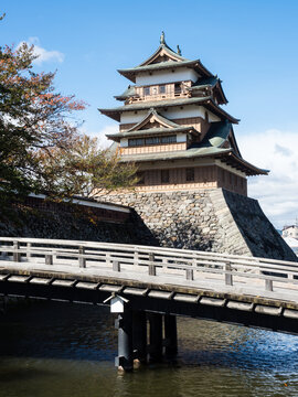 Wooden bridge across the moat leading to historic Takashima castle in Suwa - Nagano prefecture, Japan