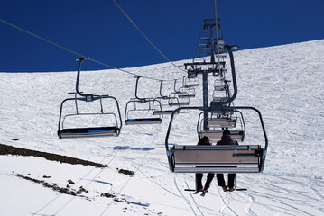 Skiers go up on the funicular on the slope of the mountain