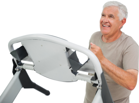 Happy senior man running on a treadmill - Powered by Adobe