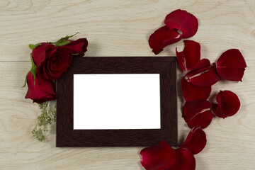 Fototapeta premium Photo frame and rose flower
