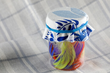 Piece of cloth secured with a rubber band on a jar