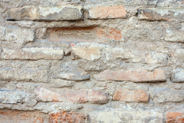 Old brick wall. Retro brickwork with cement