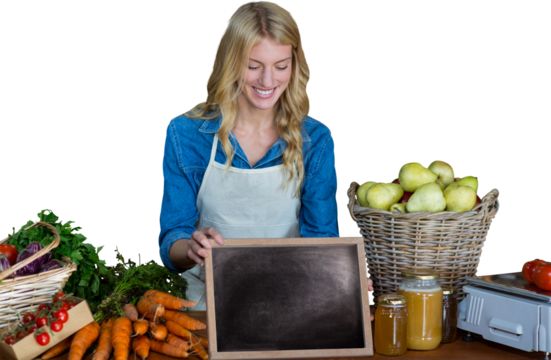 Happy woman with chalkboard and carrots - Powered by Adobe