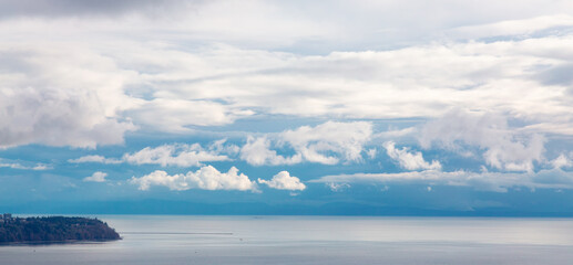 Colorful Cloudy Sky on the West Coast of Pacific Ocean. Cloudscape Nature Background. Vancouver, British Columbia, Canada.