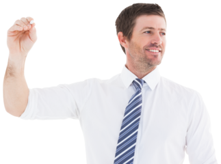 Smiling businessman writing something with white chalk