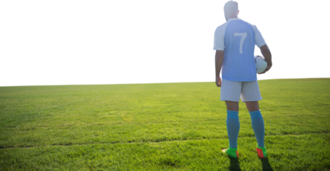 Football holding football in the ground