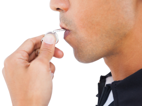 Cropped image of referee blowing whistle