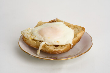 egg over toast isolated on white