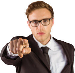 Young serious businessman pointing at camera
