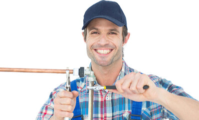 Portrait of happy plumber fixing pipe