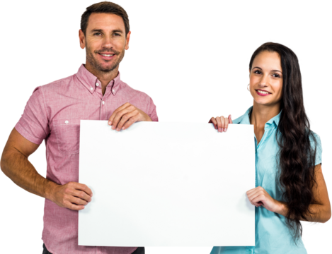 Smiling couple showing blank sheet 
