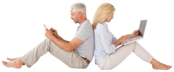 Couple sitting against while using technology
