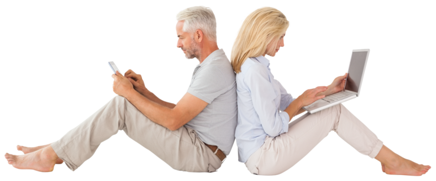 Couple sitting against while using technology