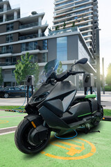 Electric scooter with charging station on a city street	