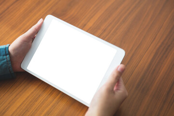 Cropped image of person holding digital tablet