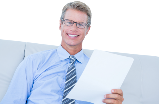 Businessman reading document at his desk