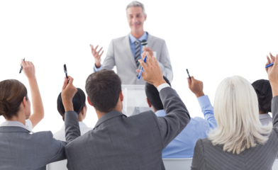 Business people raising their arms during meeting 