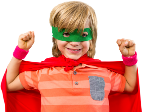 Smiling boy wearing cape and eye mask