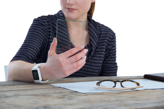 Mid section of businesswoman using glass interface