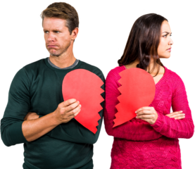 Serious couple holding cracked heart shape