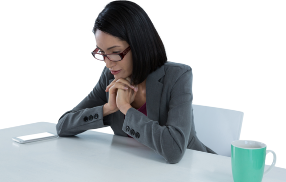 Businesswoman looking at invisible screen at desk - Powered by Adobe