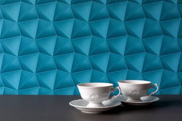 A background with blue wallpaper - colorful space. Coffee for Two: White Cups for a Couple. Elegant Coffee: Two White, Simple Cups.