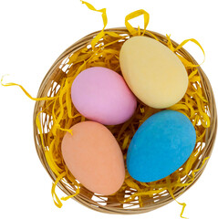 Colorful Easter eggs in wicker basket nest