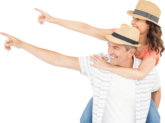 Man piggy backing wife