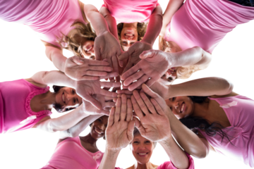 Directly below portrait of females in pink outfits stacking hands for breast cancer awareness