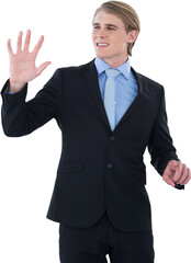 Smiling young businessman gesturing on invisible interface