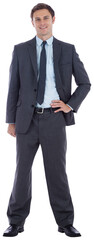 Smiling businessman with hand on hip