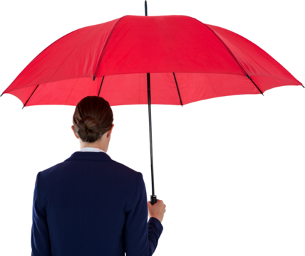 Rear view of businesswoman holding red umbrella