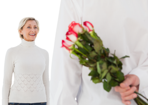 Man hiding bouquet of roses from older woman