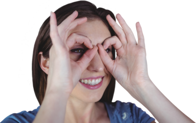 Woman using hands as binoculars